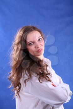 young woman portrait, studio shoot on blue