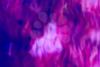 Burning flames of the purplr and blue colors background