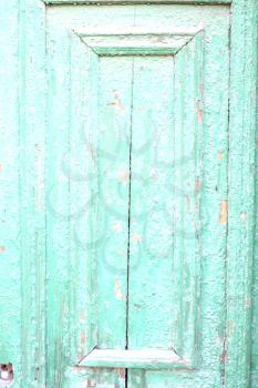 Old wooden texture. The green paint is faded and cracked