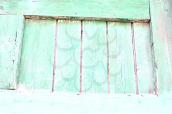 Old wooden texture. The green paint is faded and cracked