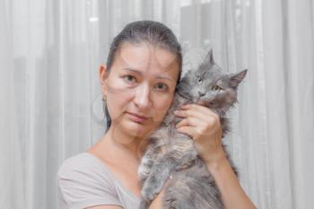 women with a cat indoors