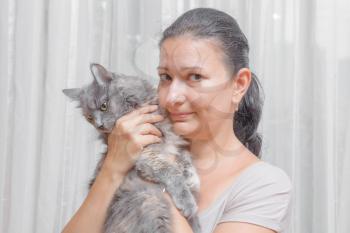 women with a cat indoors