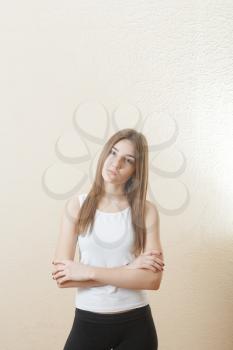 pretty yound slim woman torso shot on white background in sport form indoors health concept