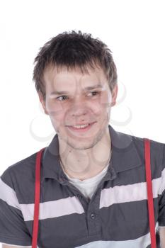 Close-up portrait of handsome young man with serious face looking at camera