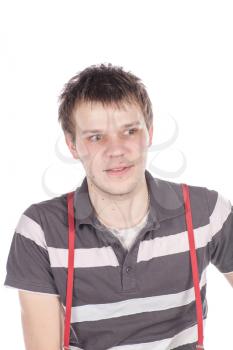 Close-up portrait of handsome young man with serious face looking at camera