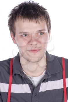 Close-up portrait of handsome young man with serious face looking at camera