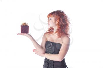 pretty red-haired girl with giftbox on white