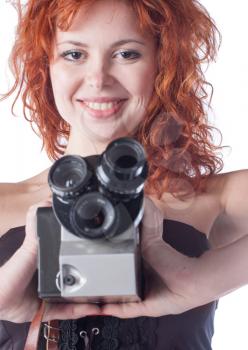 Portrait of a beautiful woman with the vintage camera