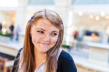 Photo of young beautiful lady inside the big mall