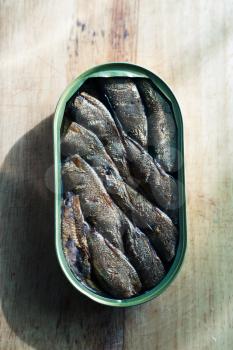 Smoked sprats in a jar on your desk