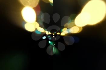 Traffic lights in the background with blurring spots of  light, copyspace