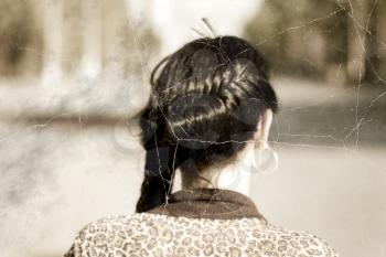 Old photo stylized headshot of a braided brunette women from back.