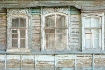 Old windows of obsolete wooden traditional Russian house