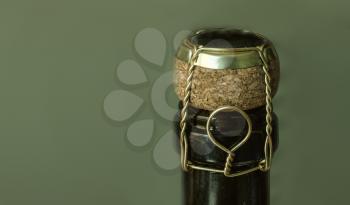 Italian Wine bottle neck with cork fastened with wire side view with copyspace.