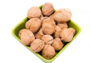 walnuts in plate isolated na white background