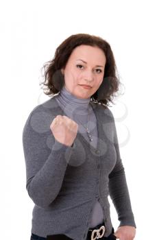 mid adult woman shows the fist  isolated on white background