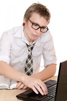 a male student works on the laptop isolated on white background