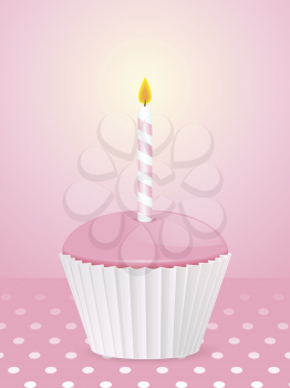 pink cupcake with candle on a pink polka-dot background