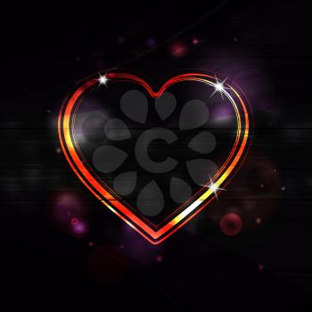 glowing valeninte heart on a black background with lens flares