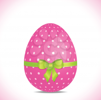 Pink polka dot easter egg with green ribbon