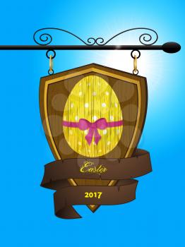 Wooden Shield and Banner Sign with Decorated Easter Egg and Text Over Blue Sunny Sky Background