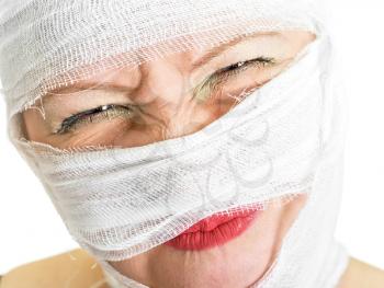 Royalty Free Photo of a Woman With Bandages on Her Face