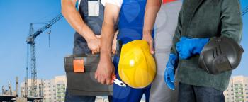 Royalty Free Photo of Workers Standing In Front of a Building