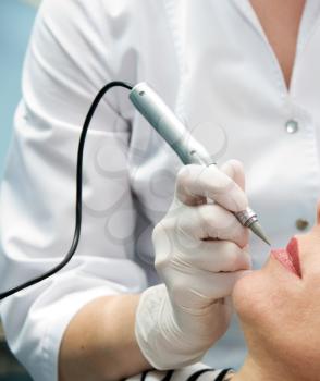 Royalty Free Photo of a Woman Getting a Cosmetic Tattoo