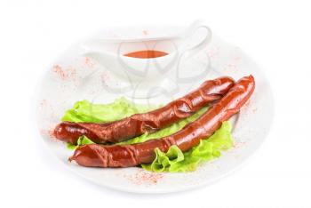 Royalty Free Photo of Grilled Sausage on Lettuce