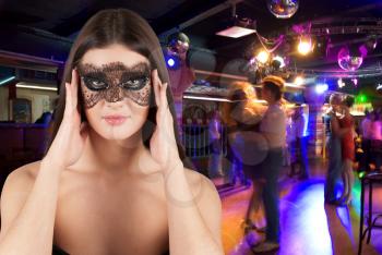 Royalty Free Photo of a Woman Wearing a Mask at a Masquerade