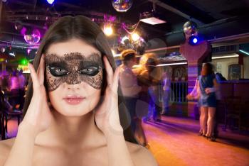 Royalty Free Photo of a Woman Wearing a Mask at a Masquerade