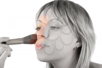 Royalty Free Photo of a Woman Applying Make-up With a Brush