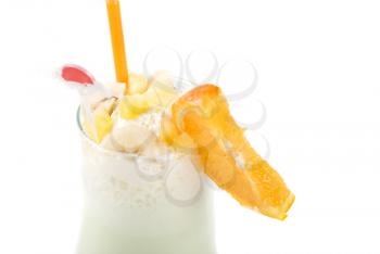 milk fruit cocktail with slice of orange cream and pipe