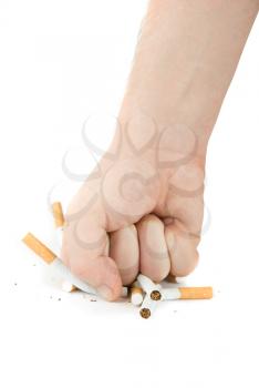 Royalty Free Photo of a Fist Crushing Cigarettes