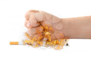 Royalty Free Photo of a Fist Crushing Cigarettes