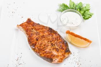 Royalty Free Photo of Grilled Salmon Steak With Sauce