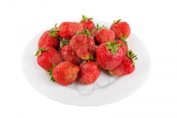 red ripe strawberries at plate isolated on white