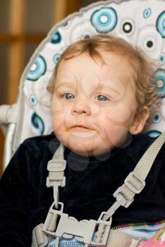 Royalty Free Photo of a Baby Boy in a Highchair 