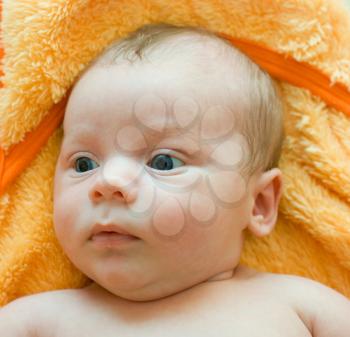 Royalty Free Photo of a Baby Boy Lying on the Bed