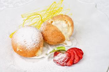 Dessert of ice-cream at biscuit with strawberry and caramel