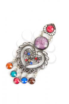 brooch with different gems isolated on a white