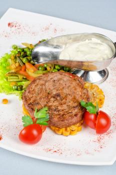 Beef steak meat with vegetables and sauce