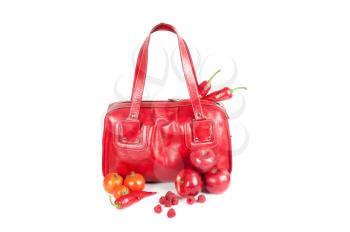 Modern fashion woman bag with fruit and vegetable on a white