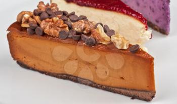 slice of cheesecake with chocolate and nuts