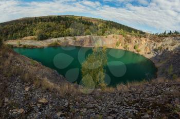 Blue lake in Altai. This is a former copper mine that was flooded with water