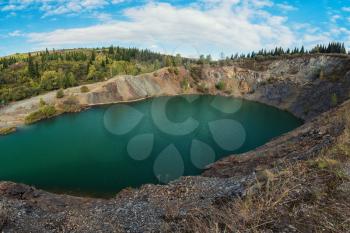 Blue lake in Altai. This is a former copper mine that was flooded with water