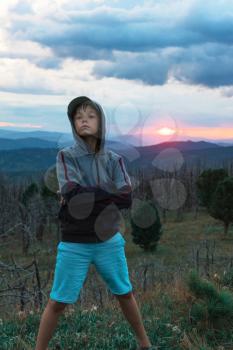 Boy at the evening in Altai mountains