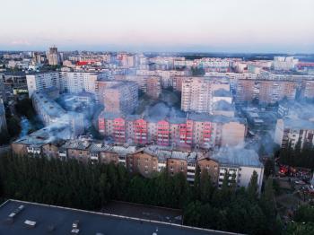 Aerial shots of house burning in the city