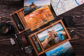 Wooden photo box with photo from travel. Decorated with different things. Travel concept.