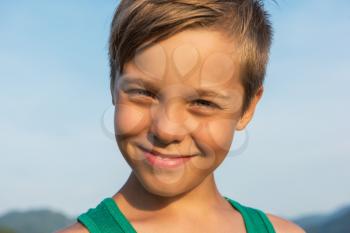 Closeup portrait of a boy in beauty summer day.